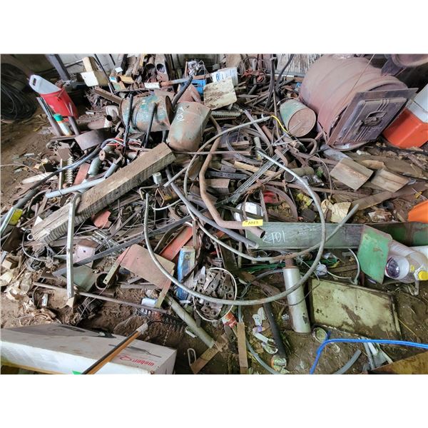 Large pile of scrap on north side of shed.