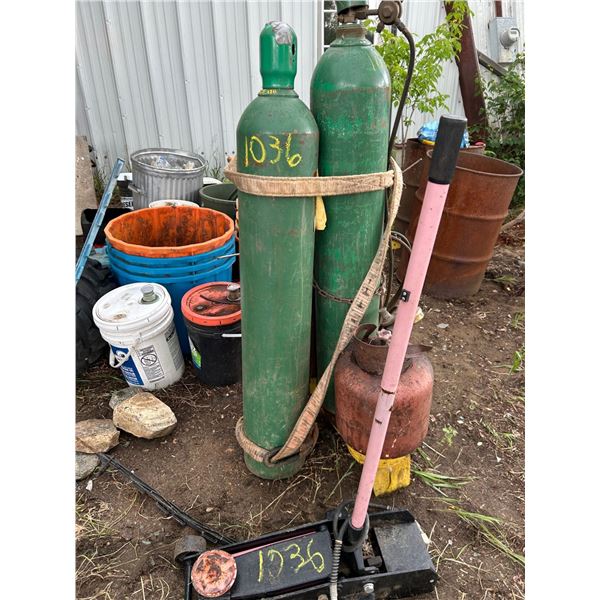 Cutting torch complete on propane, 2 owned oxypro bottles. Good condition. Air over hyd floor jack,