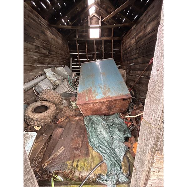 Contents of wooden building. Halters, stock heaters, tires, copper cable, cat rollers, furnace etc.