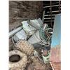 Image 3 : Contents of wooden building. Halters, stock heaters, tires, copper cable, cat rollers, furnace etc.