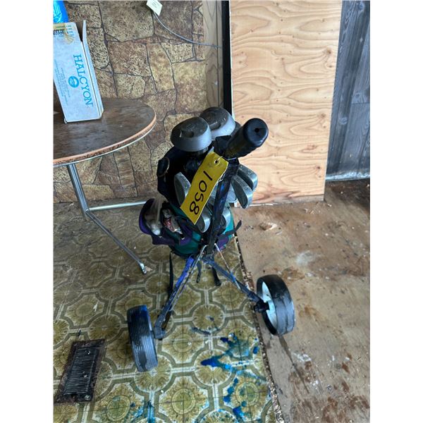 Complete set of left hand men's golf clubs. Graphite shafts w/cart. (Inside house trailer).