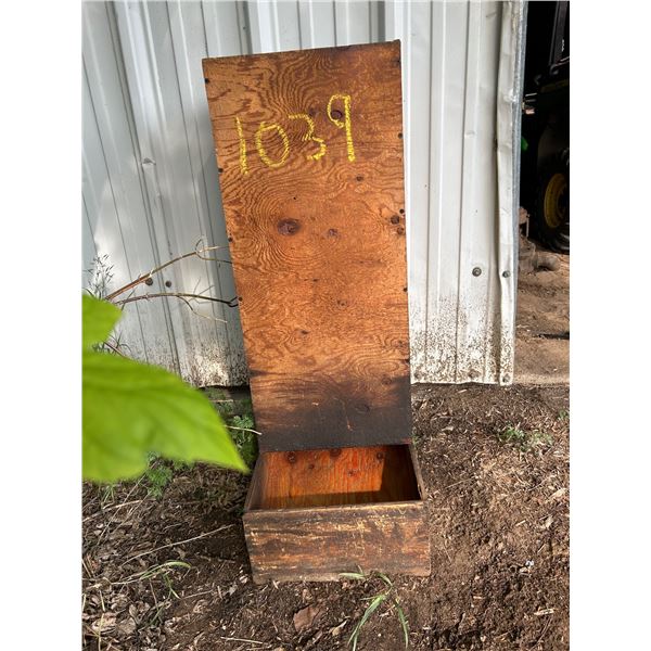 Homemade wooden pet gravity feeder.