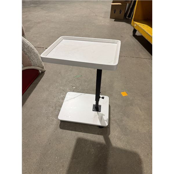 Height  adjustable table on wheels