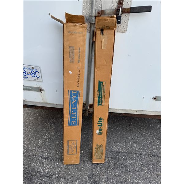 Two Vintage projector screen screens