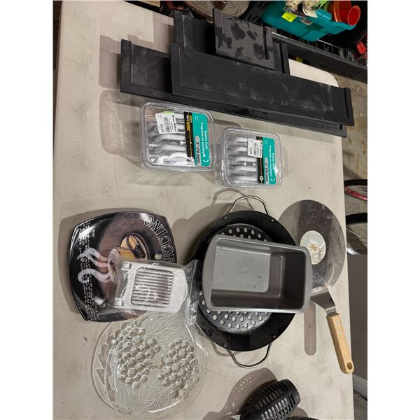 Kitchen items, plastic poles, and wall shelves