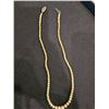 Image 1 : Strand of white, coated (peeling) round beads. 17" long