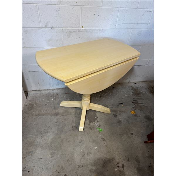 Drop side pedestal table
