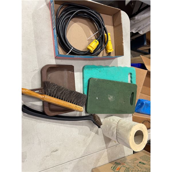 Power cord, gardening mats roll of paper, brushes, and dust