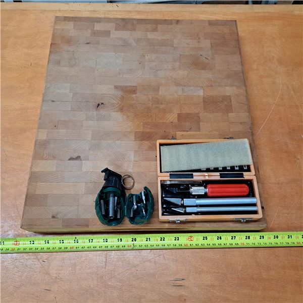 wood block with scalpel and screw driver-set looks like a grenade