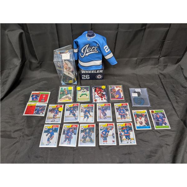 Lot of sealed sports card, Blake Wheeler Stand, William Karlson Card and puck, and Pokemon Kyorge an