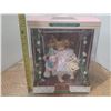 Image 1 : Classic Treasures Porcelaine Doll on Swing. (New)