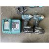 Image 2 : MAKITA 18V CORDLESS TOOL SET WITH 2 IMPACT GUNS, 3AH AND 4 AH BATTERIES, CHARGER AND CARRY BAG, TEST