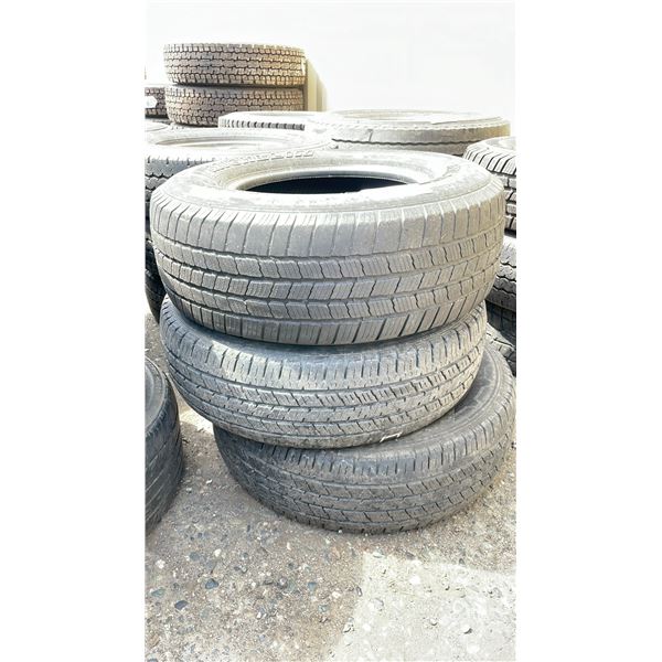 STACK OF 3 VEHICLE PERFORMANCE TIRES