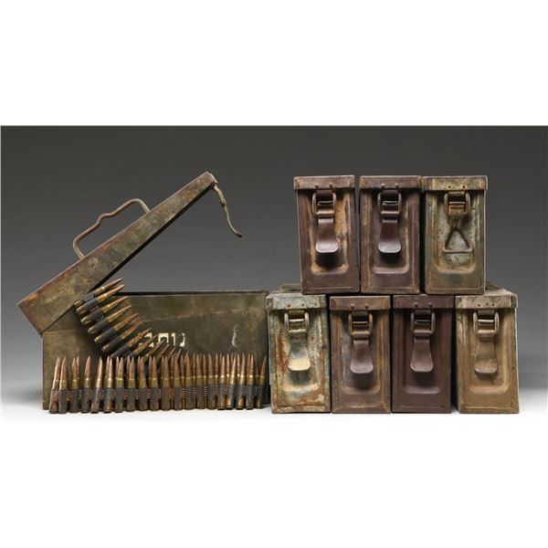 8 CANS OF LINKED 8MM MAUSER AMMO ON BELTS.