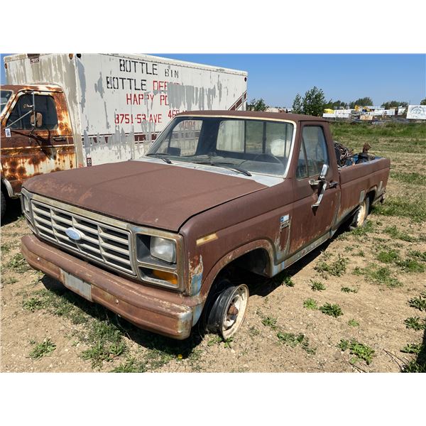 Ford F150 reg cab truck. Various motors, and tires in box. SN. Not visible