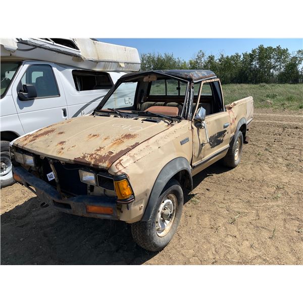 1984 Nissan truck. Tires hold air, sold for parts