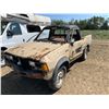 Image 1 : 1984 Nissan truck. Tires hold air, sold for parts