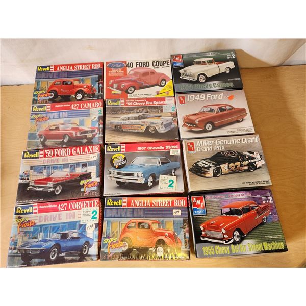 410 -- 12 COLLECTABLE REVELL, AND AMT CLASSICS MODEL KITS(SKIPS FIESTA DRIVE IN, '67 CHEVELLE, MILLE