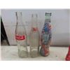 Image 8 : Coca-Cola Bottles some with Product and others 