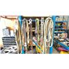 Image 1 : METAL STORAGE RACK FILLED WITH ASSORTED SLINGS, HARNESSES, CABLE & MORE