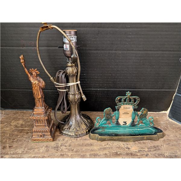 Brass lamp, Miniature statue of Liberty, and Vintage Calander