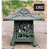 Image 1 : Cast iron outdoor citronella candle burner.