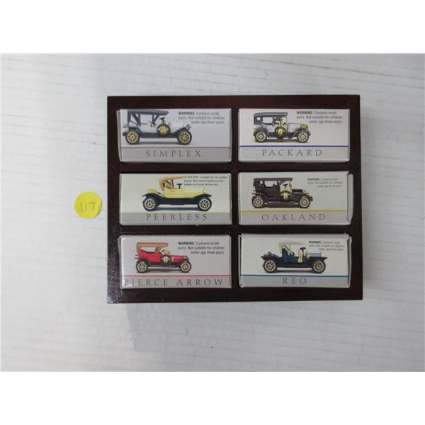 6 different die-cast cars in red wooden box