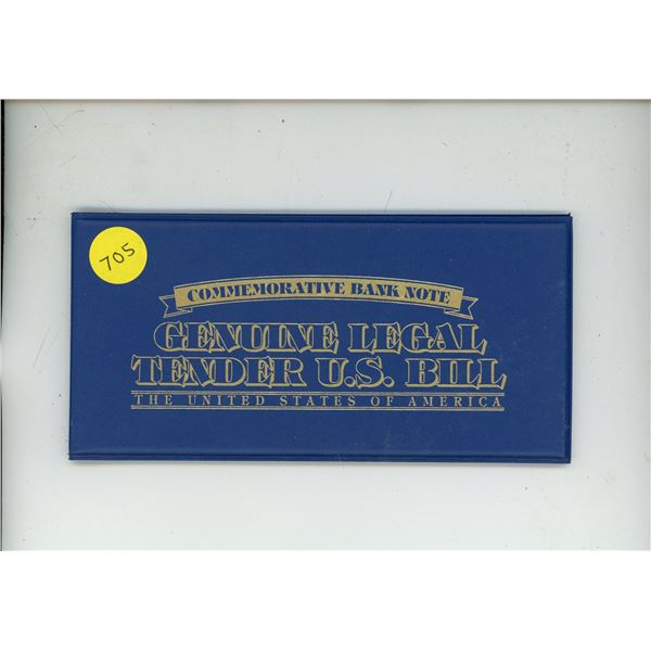 Colored U.S. $2 note that commemorates Yellowstone National Park. Housed in a folder.