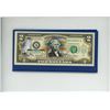 Image 3 : Colored U.S. $2 note that commemorates Yellowstone National Park. Housed in a folder.