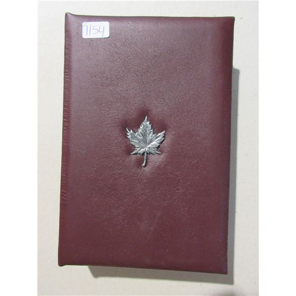 1994 Special Edition Proof Set. The Silver Dollar commemorates the last RCMP Dog Sled Team, while th