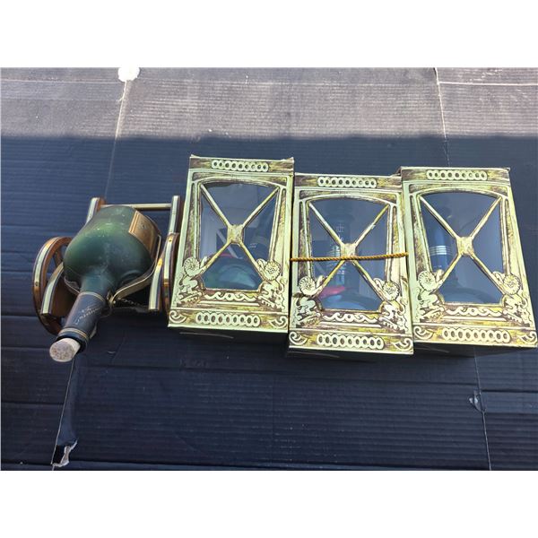 Empty whiskey bottles with original boxes and bottle holder