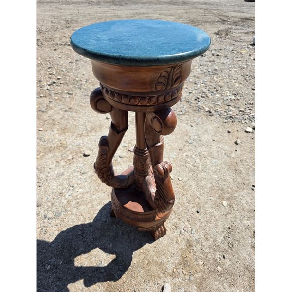 Carved wood stand with green top