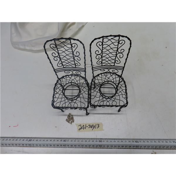 2 black small iron chairs