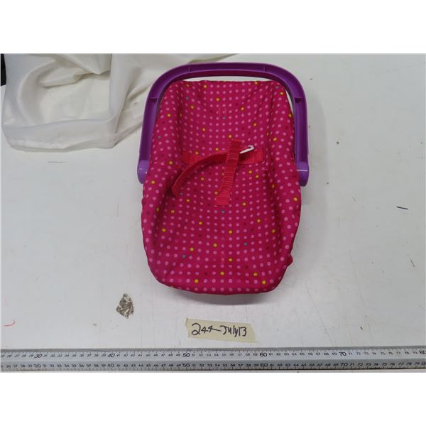 purple and pink doll carrier