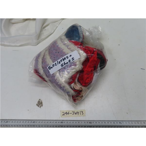 small bag of doll clothes and shoes