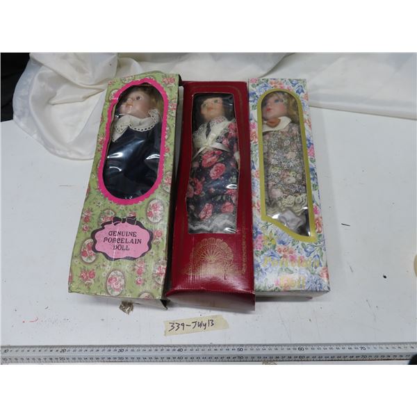 3 porcelain dolls in original box