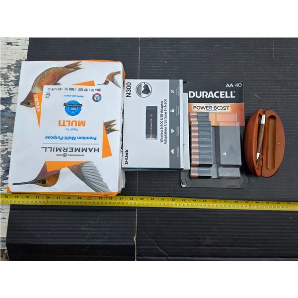 Duracel batteries, paper, pen and usb adapter