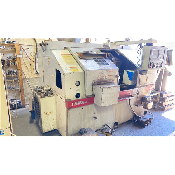 OKUMA E-SERIES ES-L10  PROGRAMABLE LATHE/ OKAUMA OSP-U10L CONTROL CENTER/WASTE CONVEYOR