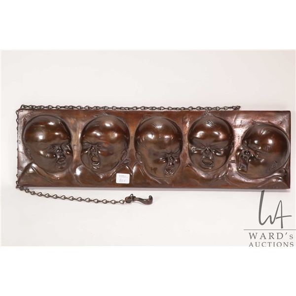Antique bronze hanging plaque featuring the Dionne Quintuplets as babies, signed E. Romeo, note: mis