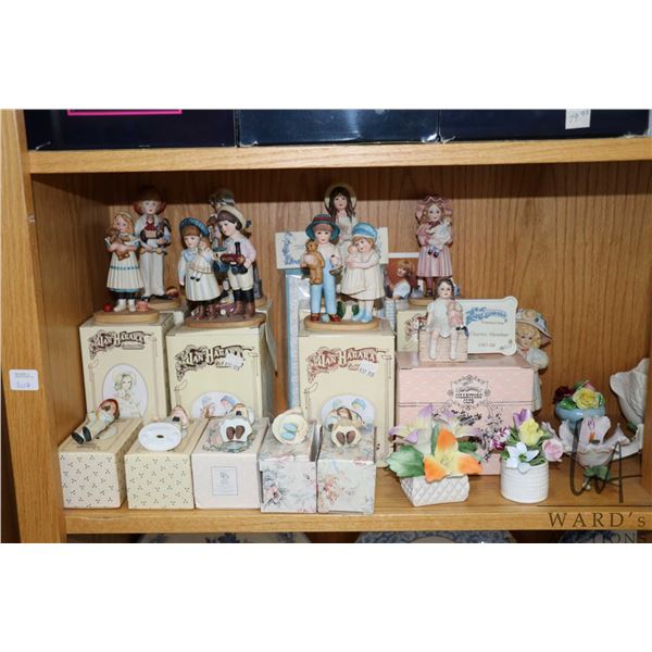 Shelf lot of boxed Jan Hagara porcelain collectible doll figures, boxed Royal Copenhagen plates, swa