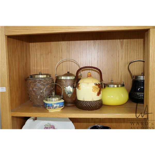 Shelf lot of collectible biscuit barrels and assorted vintage collectible bottles etc.
