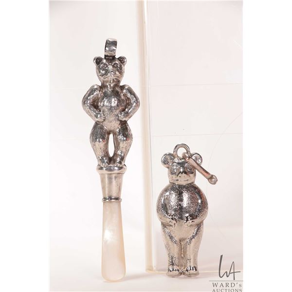 Two silver baby rattles including bear with mother-of-pearl gum soother with British sterling hallma