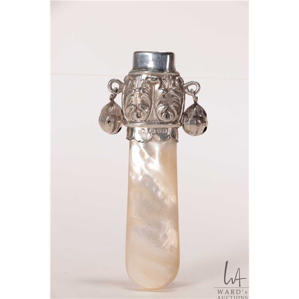 Antique sterling silver baby toy with British hallmarked top and bells and mother-of-pearl gum sooth