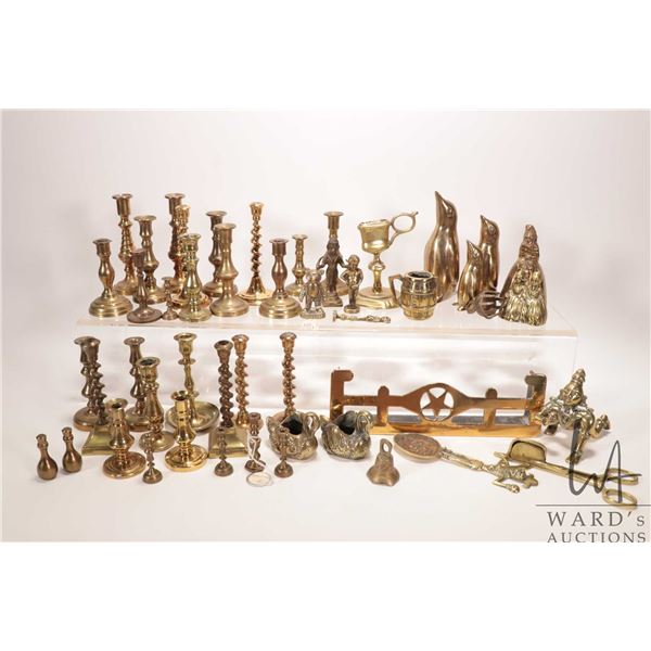 Large tray of brassware including candles sticks, candle snuffers, figures etc.