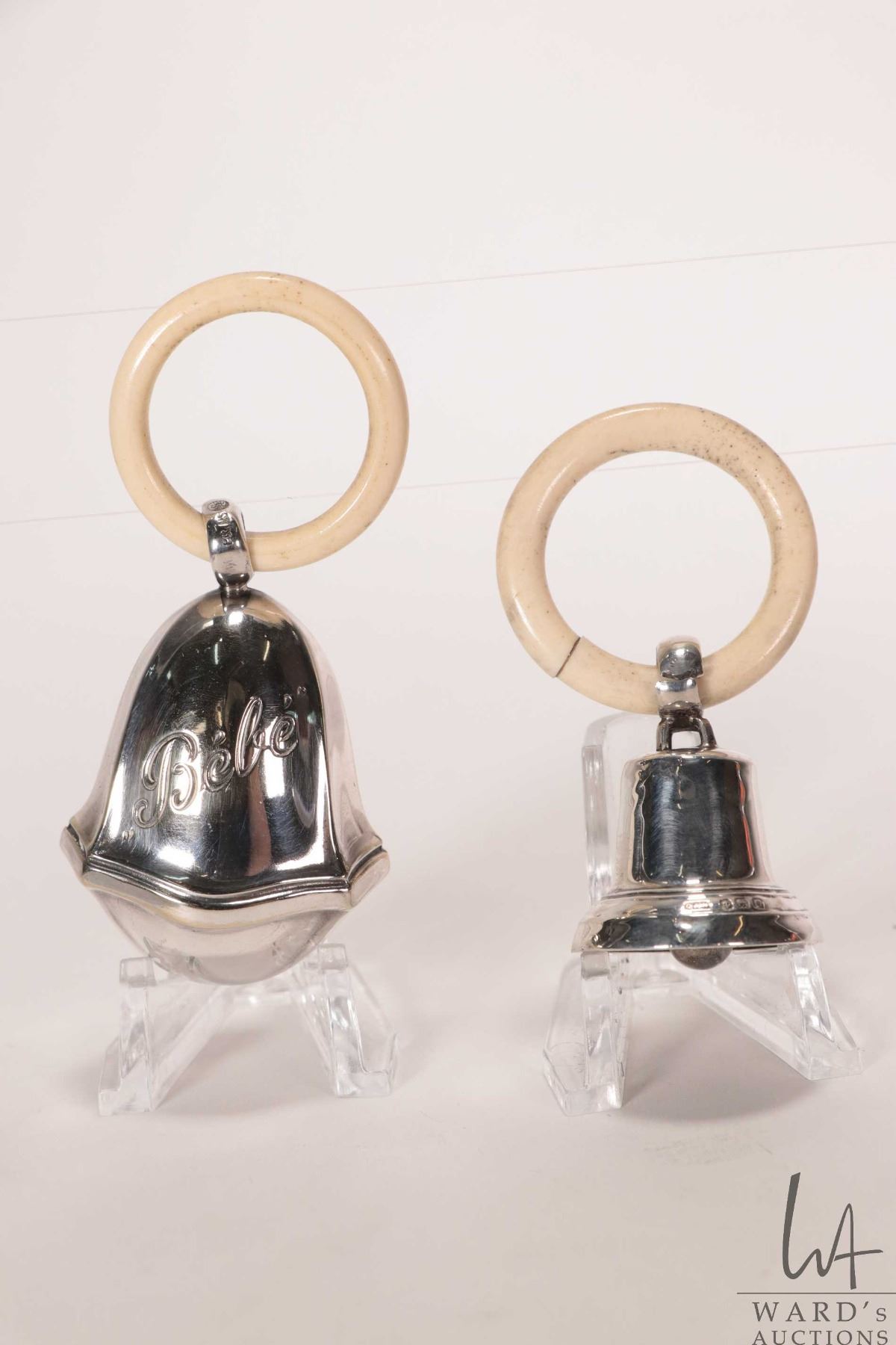 Two silver baby rattles including British hallmarked bell and silver ...
