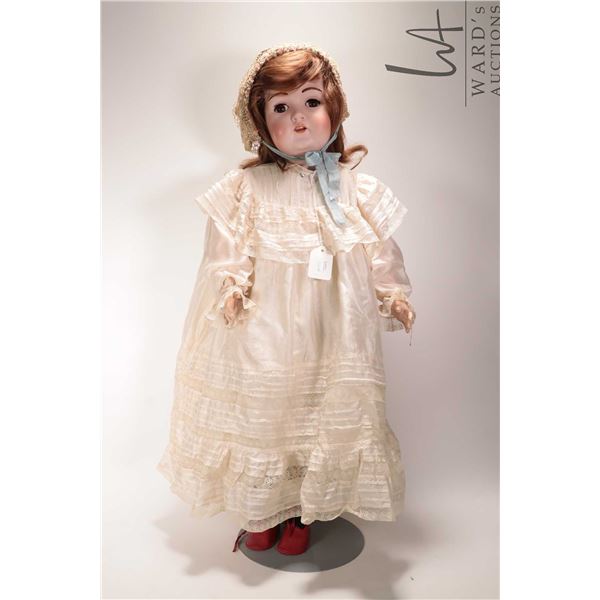 Antique 29" Kestner bisque head doll on jointed composition body, with sleep eyes, hair brows and la