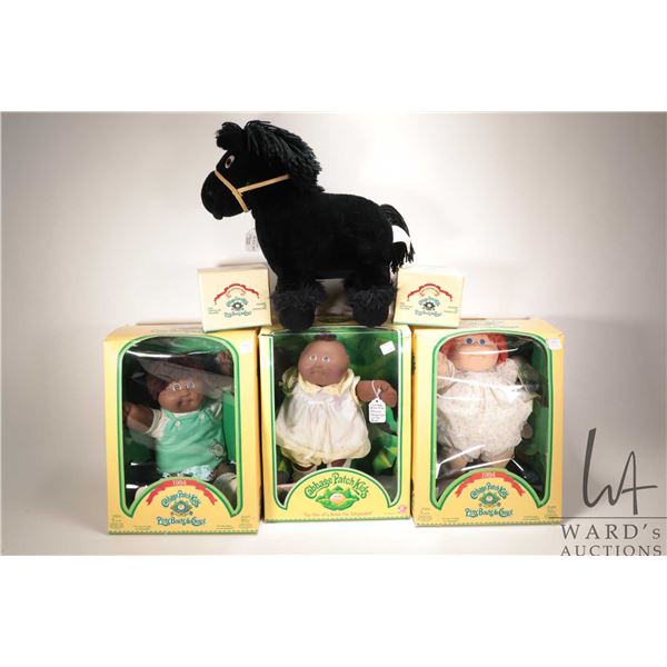Three Cabbage Patch kids, a Cabbage Patch horse and two boxed porcelain figurines