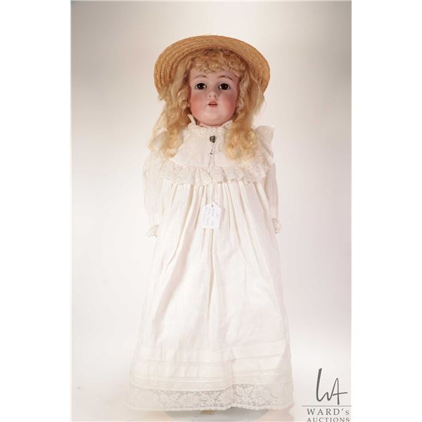 Antique 27" Kestner 154 bisque head doll with brown glass sleep eyes, bisque hands on leather body, 