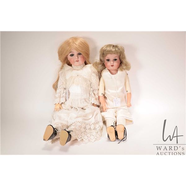 Two antique Armand Marseille bisque head dolls including "Queen Louise" 24" on leather body with com