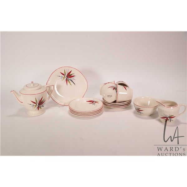Vintage English made child's tea service with teapot, cream and sugar, four cups and saucers, four s
